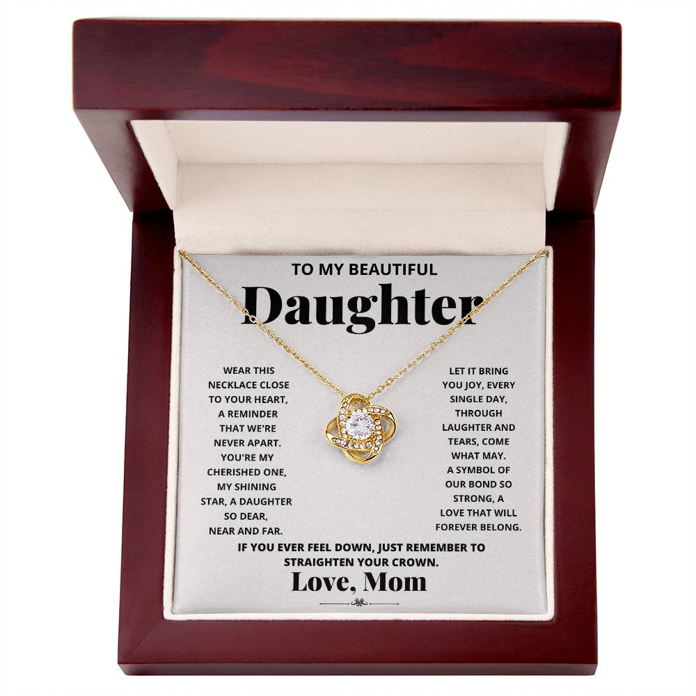 To My Beautiful Daughter, Wear This Necklace - Love Knot Necklace shaped pendant necklace with encrusted jewels on a card with a sentimental message from a mother to her daughter.