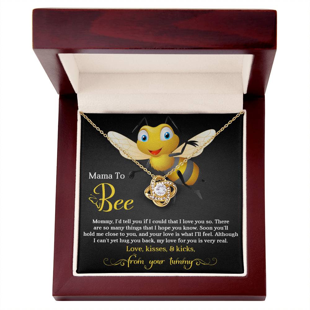 A "To Mom To Be, Hope You Know - Love Knot Necklace" with a bee design and a cubic zirconia heart-shaped jewel, presented in a box with a sentimental message for an expectant mother by ShineOn Fulfillment.