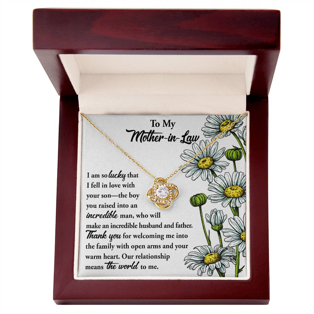 To Mother-In-Law, Warm Heart - Love Knot Necklace on a floral card with a heartfelt message to a mother-in-law, expressing gratitude and affection.