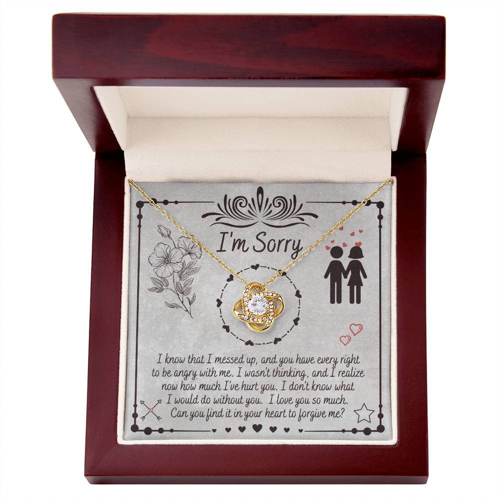 The "Sorry-I Would Do - Love Knot Necklace" is a personalized gift box that includes an apology message and a Love Knot Necklace adorned with cubic zirconia crystals. The box features the phrase "I'm Sorry" above illustrations of flowers and a couple, expressing regret for a mistake and seeking forgiveness.