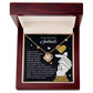 The Soulmate-Look At You - Love Knot Necklace features a heart-shaped cubic zirconia pendant, presented in an open wooden box with a romantic message card titled "To My Stunning Soulmate.