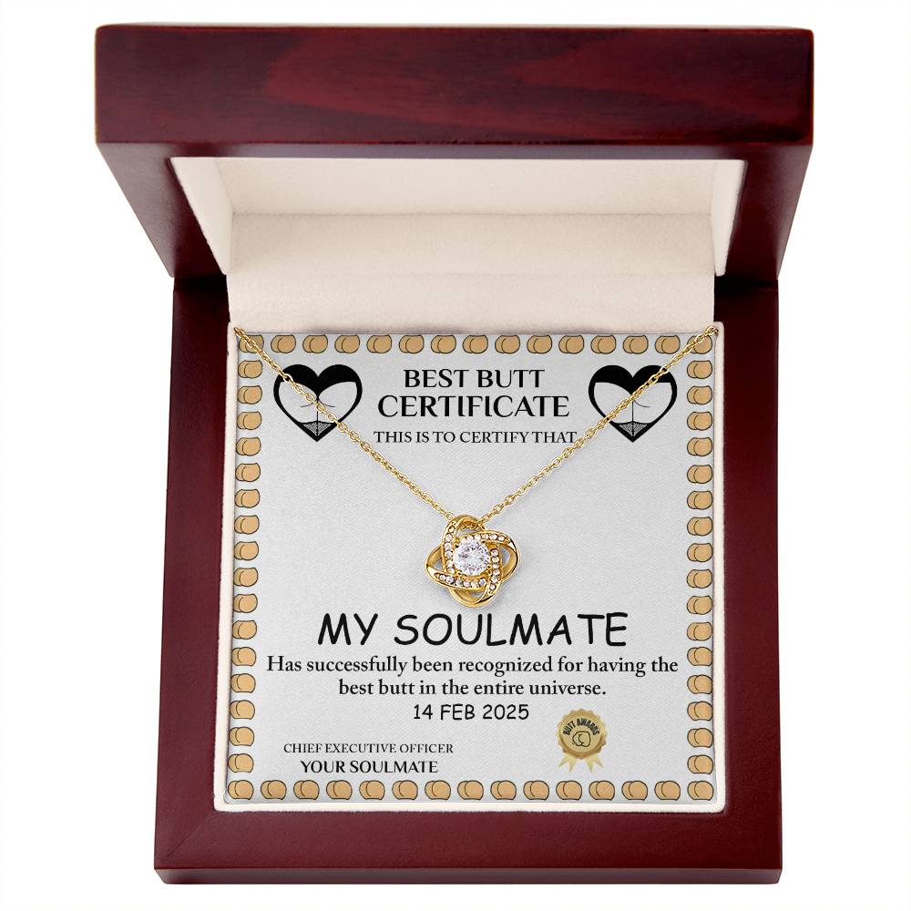 The Love Certificate-Best Butt - Love Knot Necklace features cubic zirconia crystals in an open wooden box and comes with a humorous "Best Butt Certificate" for "My Soulmate," dated 14 Feb 2025, blending elegance and humor for a memorable Valentine's Day gift.