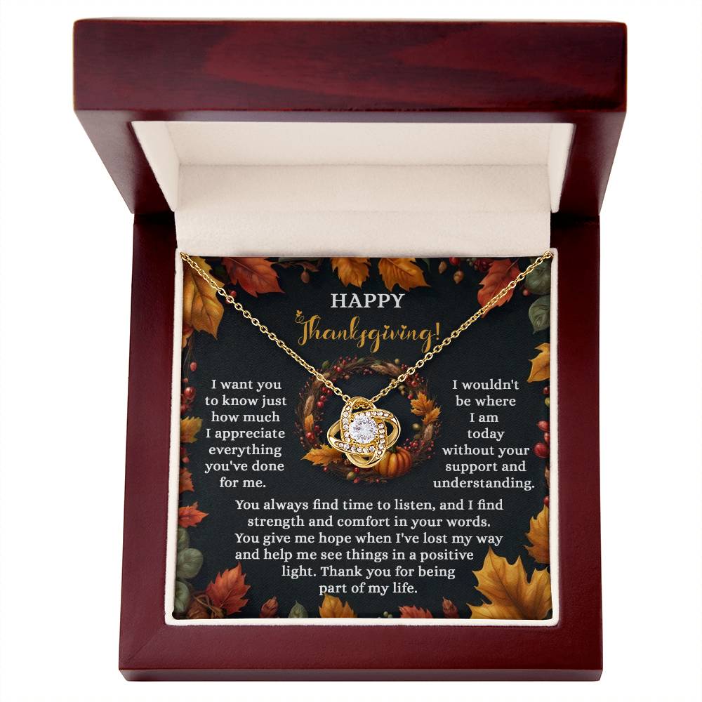 The Thanksgiving-Lost My Way - Love Knot Necklace is crafted with sparkling cubic zirconia crystals and presented in an elegant wooden box. It features a heartfelt Thanksgiving message embraced by autumn leaves, while its heart-shaped design with a yellow gold finish exudes elegance and warmth.