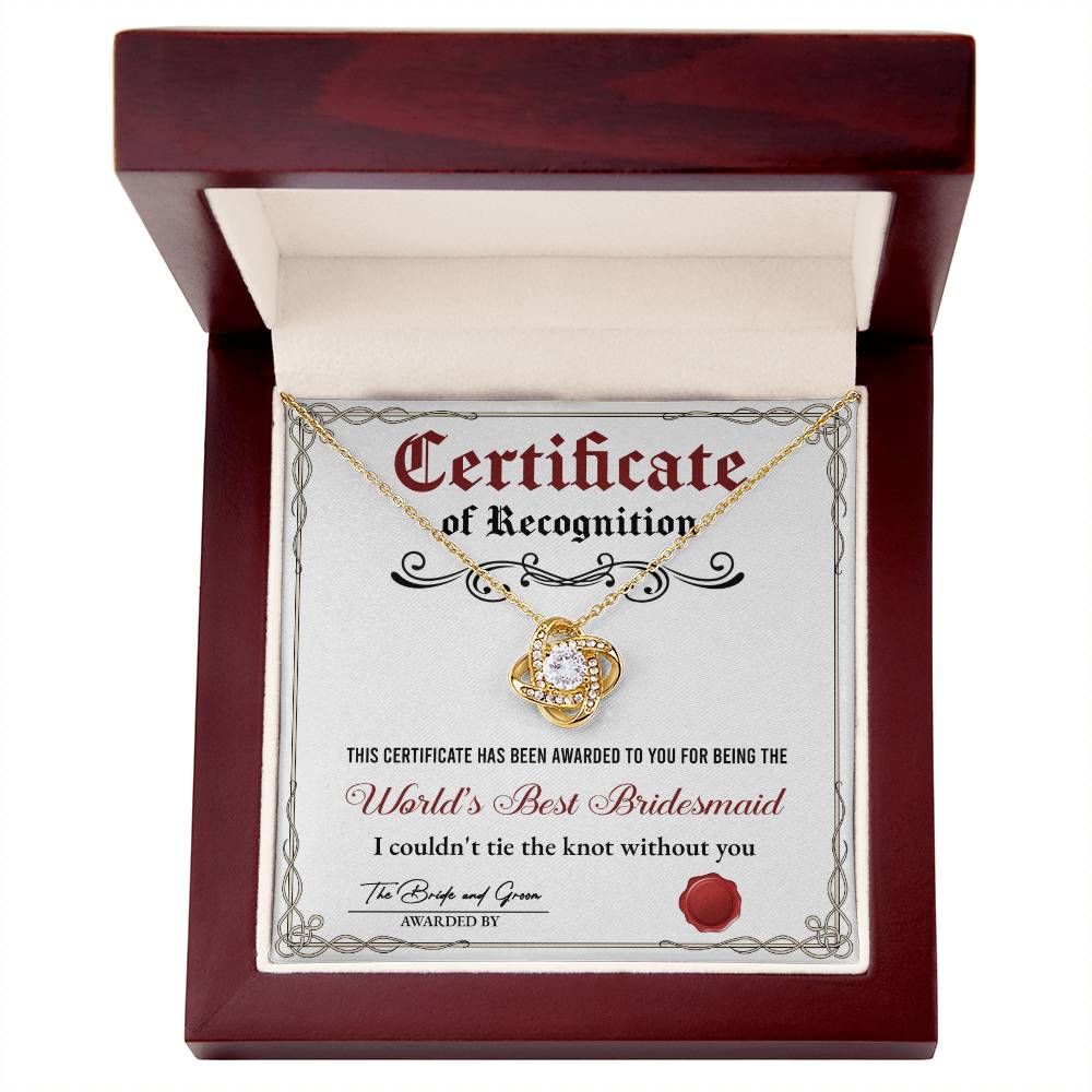 A stunning To Bridesmaid, Certificate Of Recognition - Love Knot Necklace in 14k white gold, adorned with cubic zirconia crystals, is displayed on a certificate that reads "World's Best Bridesmaid" awarded by the bride and groom.