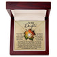 The "Daughter-Stood Your Ground - Love Knot Necklace" with a gold finish and pendant is elegantly showcased in a box. The box features a heartfelt message addressed "To my Daughter," expressing pride, admiration, and encouragement. Sparkling cubic zirconia crystals adorn the necklace, adding an extra touch of elegance.