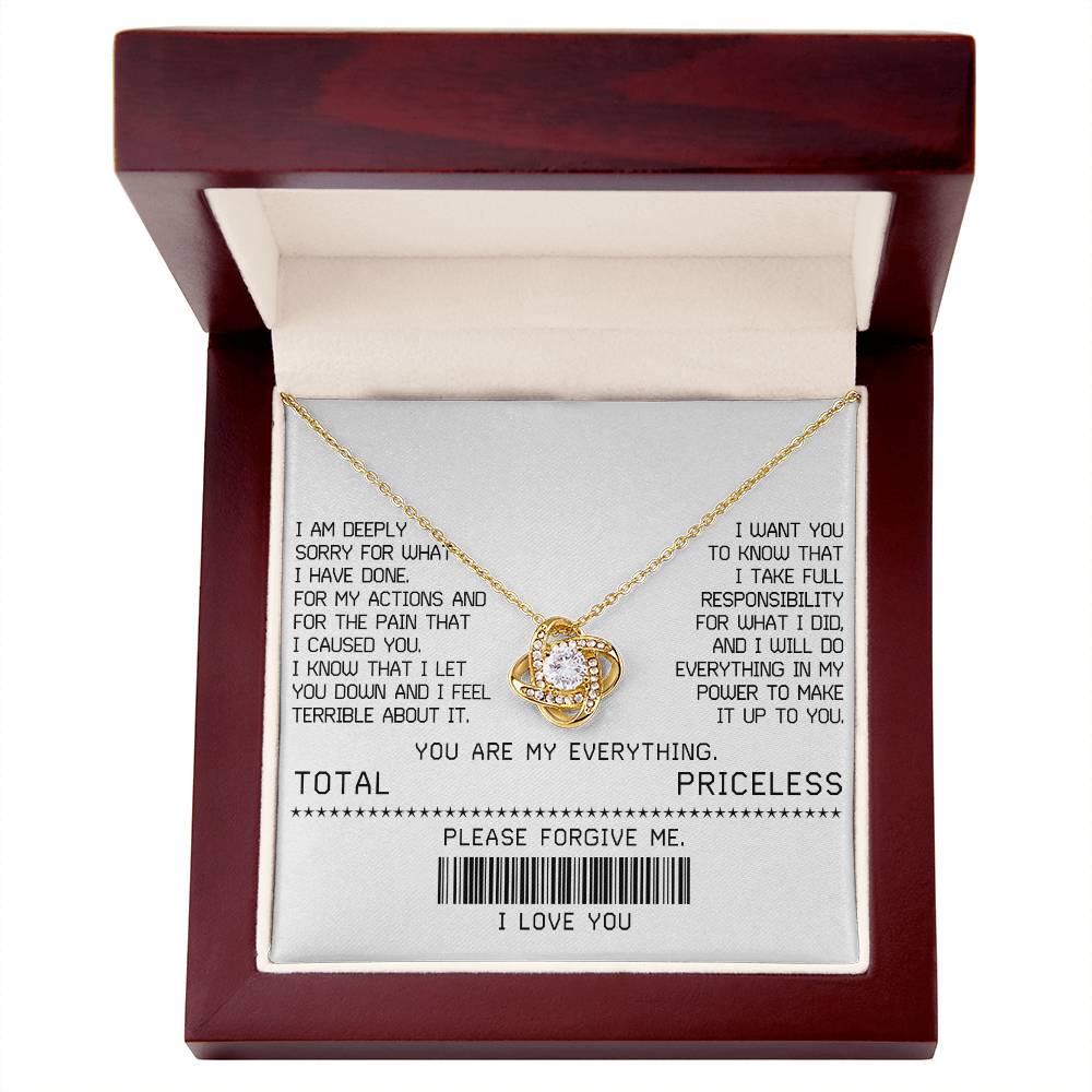 The Sorry-Make It Up - Love Knot Necklace, featuring a white gold finish and adorned with shimmering cubic zirconia crystals, is beautifully presented on a card with an apology message. This card includes phrases such as "TOTAL PRICELESS," "PLEASE FORGIVE ME," and "I LOVE YOU," along with a barcode, making it the perfect elegant touch for your sincere apology.