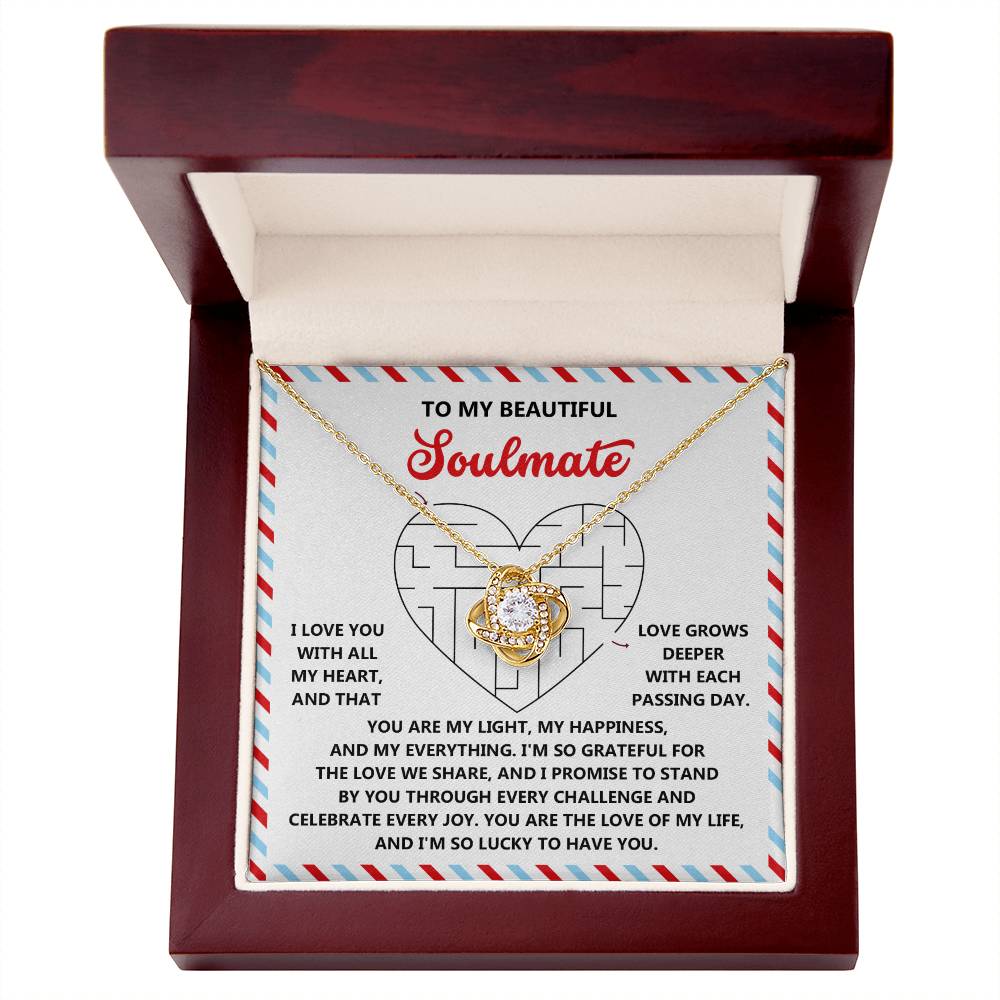 The Soulmate-To Have You - Love Knot Necklace features a gold-finished knot with a cubic zirconia pendant, elegantly presented in a wooden box. The lining includes a heartfelt message to your soulmate, filled with love and gratitude, making it an ideal token of affection.