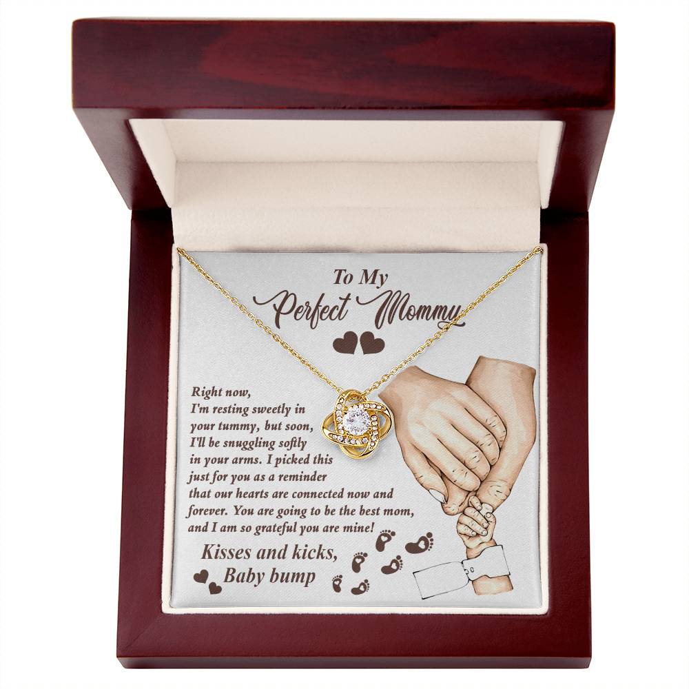 A To Mama To Be, Now And Forever - Love Knot Necklace with a cubic zirconia pendant in a gift box featuring an affectionate message for an expectant mother by ShineOn Fulfillment.