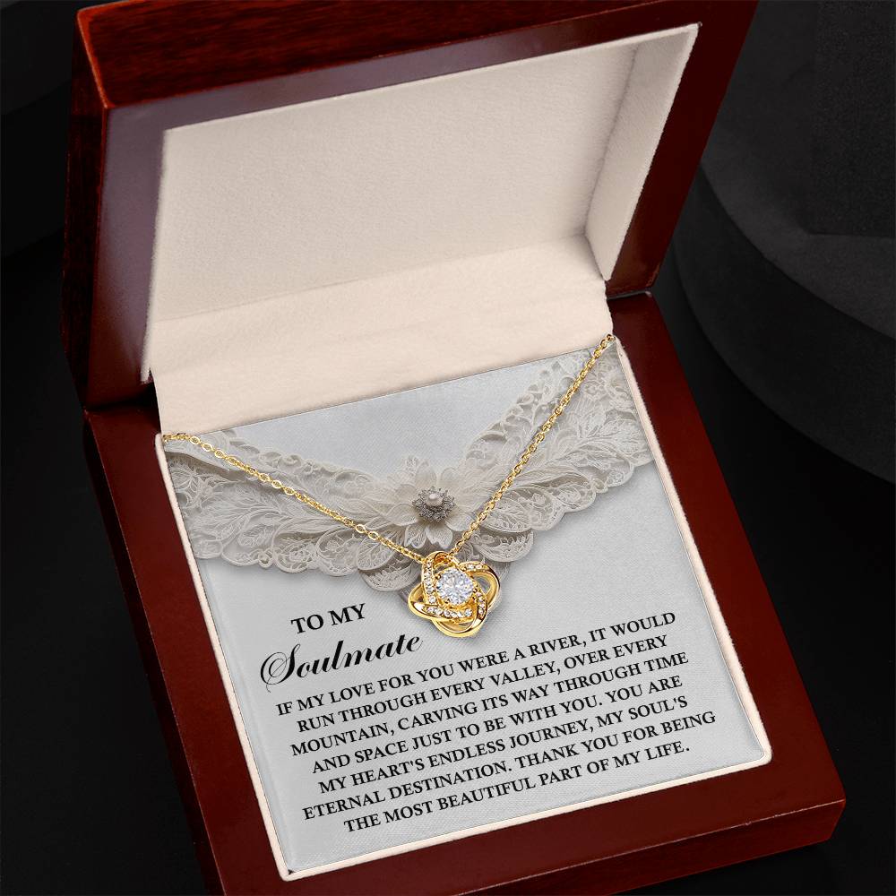 The Soulmate-Eternal Destination Love Knot Necklace comes in an elegant box, adorned with shimmering cubic zirconia crystals and a heartfelt message for your soulmate.