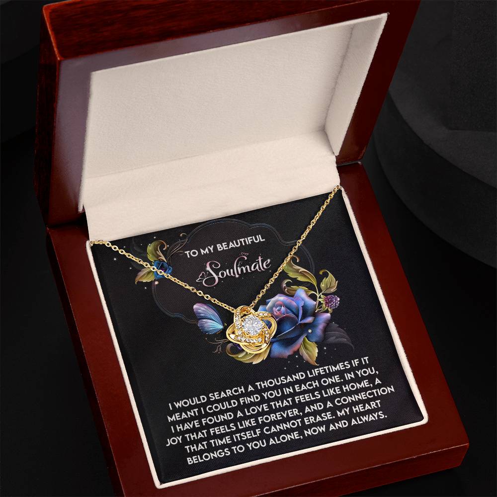 The Soulmate-Like Home Love Knot Necklace, featuring sparkling cubic zirconia, is presented in a wooden box with a floral card bearing a heartfelt message to your soulmate. This personalized gift beautifully expresses love.