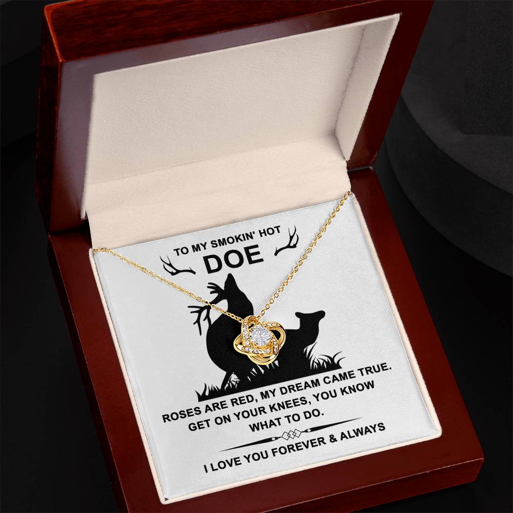 The Soulmate-Dream Came True - Love Knot Necklace, adorned with sparkling cubic zirconia crystals, is presented in a box with the message: "To my smokin' hot doe. Roses are red, my dream came true. Get on your knees, you know what to do. I love you forever & always." A symbol of our unbreakable bond.