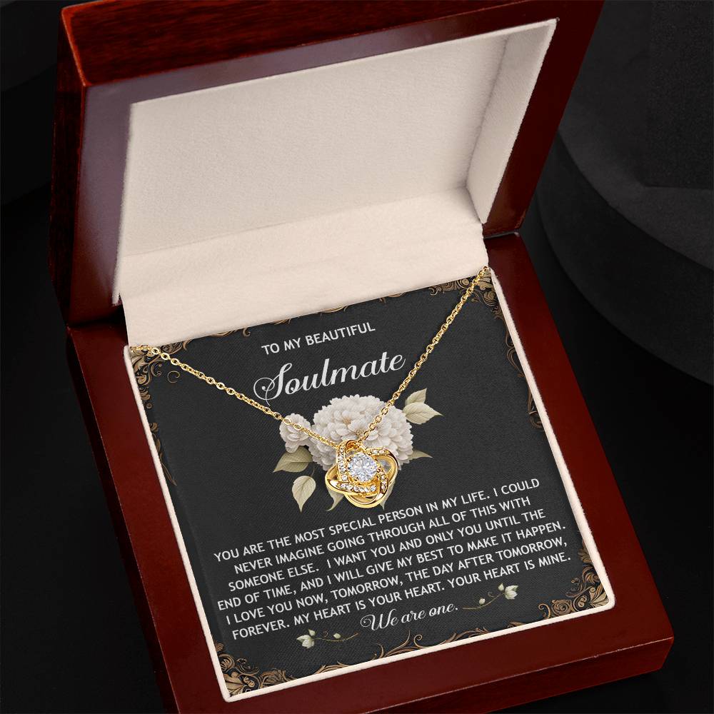 The Soulmate-We Are One Love Knot Necklace, in white or yellow gold finish, features intertwined hearts with cubic zirconia crystals. It’s presented in a gift box with a heartfelt soulmate message, symbolizing eternal love.