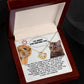 The Sorry-Make It Right - Love Knot Necklace showcases a heartfelt note adorned with two cats, one angry and the other sad. The note conveys remorse with the message, "I'm sorry for hurting you," alongside a promise to improve. Enhanced by cubic zirconia crystals and personalized for an intimate touch, it reads "I LOVE YOU FOREVER.