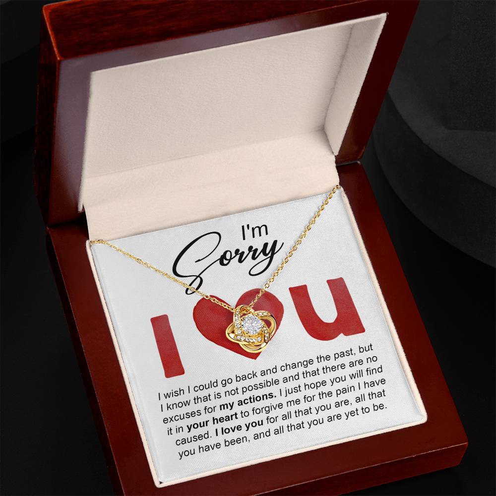 The Sorry-Change The Past - Love Knot Necklace comes with an apology message that reads, "I'm sorry. I wish I could go back and change the past... I love you for all that you are, all that you have been, and all that you're yet to be." This beautiful necklace is available in either a white gold or yellow gold finish, adorned with sparkling cubic zirconia crystals.