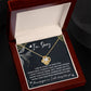 The "Sorry-The Best Thing - Love Knot Necklace" is presented in a small, open box that includes an apology message saying "I'm Sorry," along with a heartfelt note expressing regret and love. The necklace showcases a premium cubic zirconia centerpiece, making it the ideal personalized gift to mend hearts.