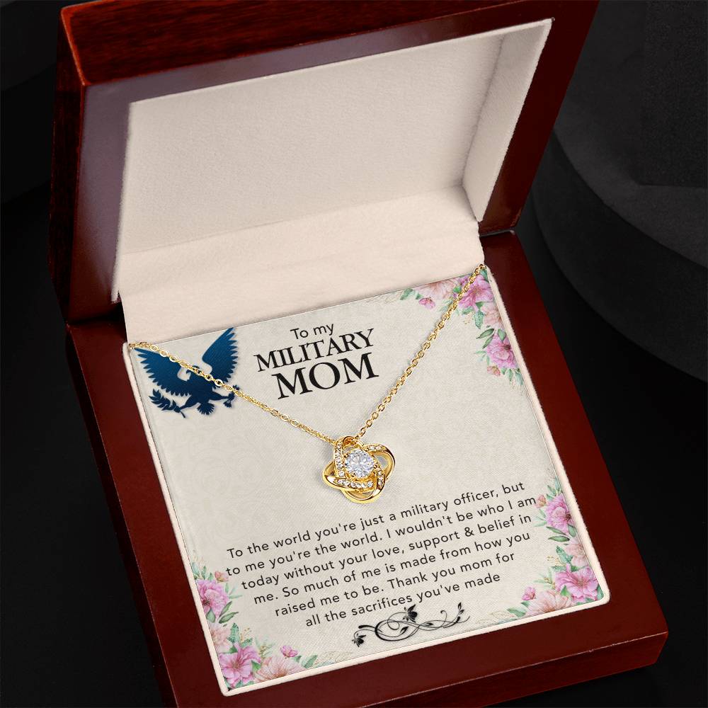A To My Military Mom, To The World You're Just A Miltary Officer Love Knot Necklace for a military mom presented in a wooden box, symbolizing the sacrifices made by ShineOn Fulfillment.