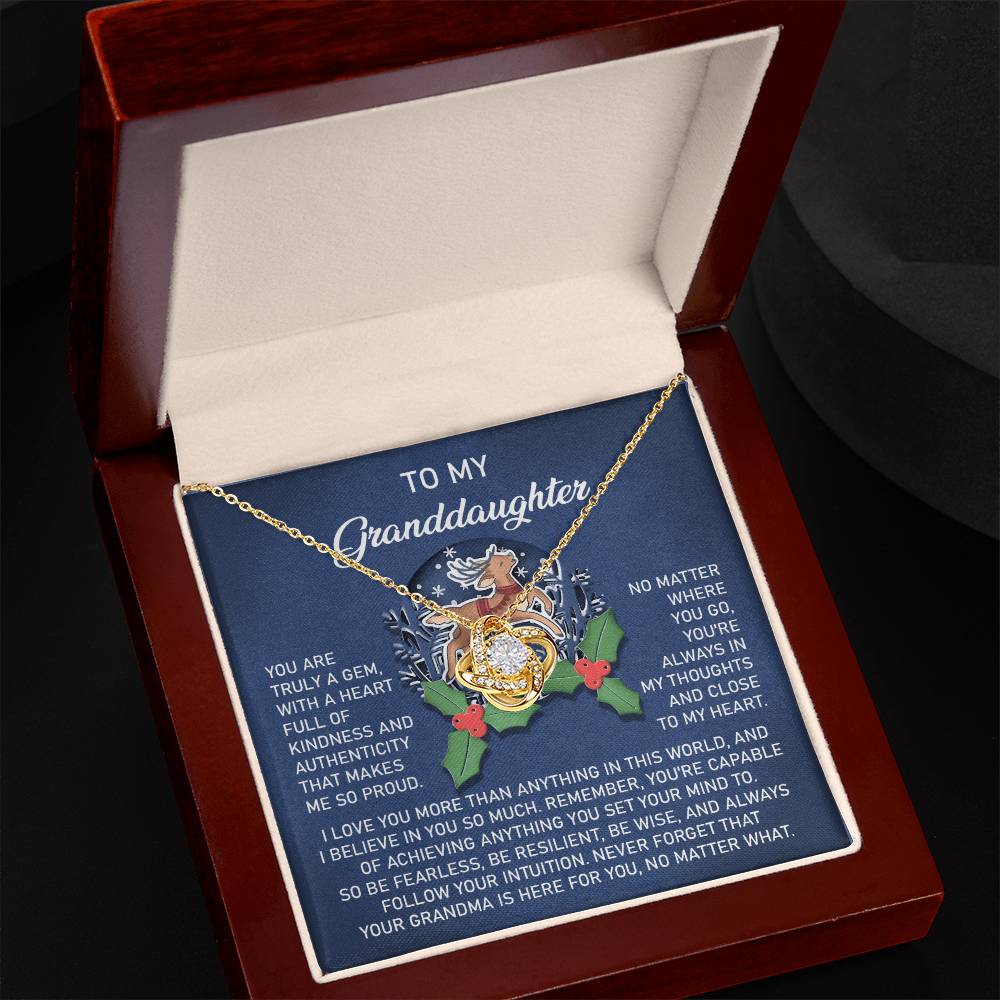 The Granddaughter-Here For You - Love Knot Necklace is beautifully presented in a wooden gift box, showcasing a stunning lion and rose design along with a touching message for your granddaughter. Made from 14k white gold and embellished with sparkling cubic zirconia, it symbolizes eternal love and treasured bonds.