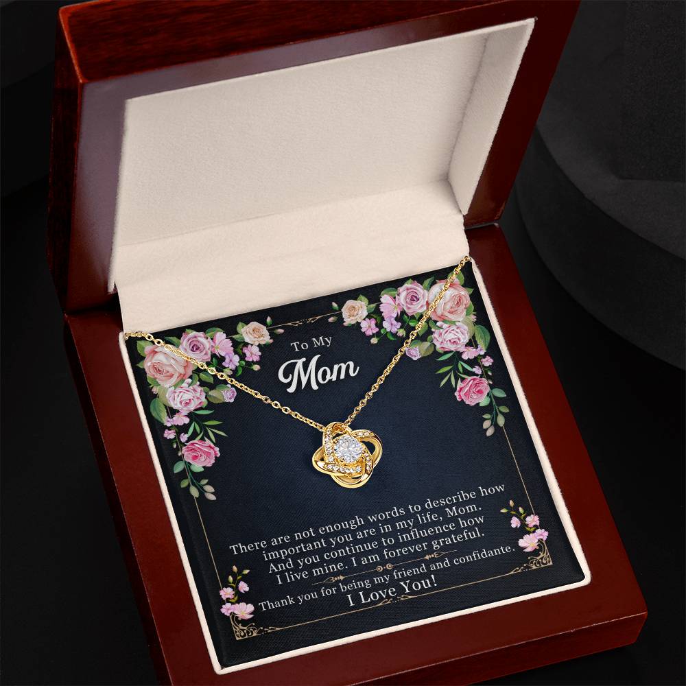 A gold finish heart-shaped To My Mom, Thank yOU For Being My Friend - Love Knot Necklace with a loving message for a mother, presented in an open gift box by ShineOn Fulfillment.