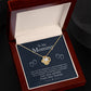 An open jewelry box with a To My Mommy, Love From Your Tummy - Love Knot Necklace in a gold finish, accompanied by a message for a mother from her child. (Brand: ShineOn Fulfillment)