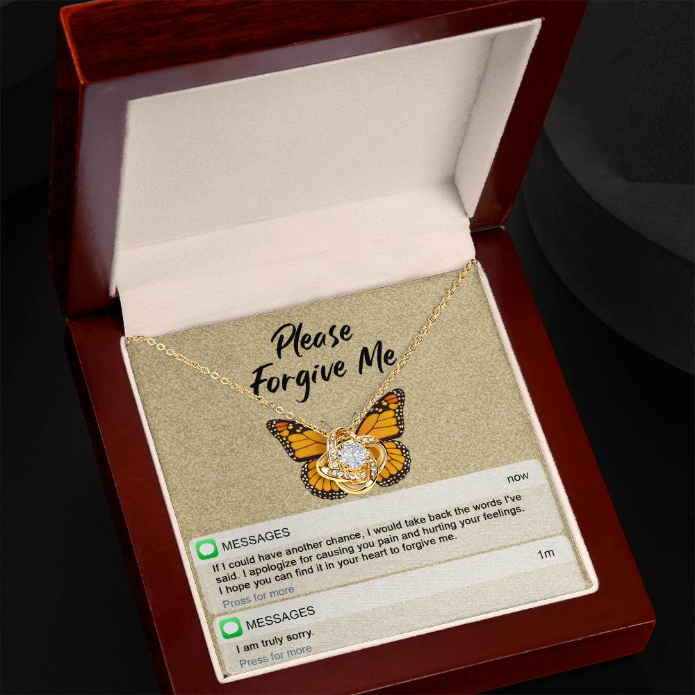 The "Sorry-In Your Heart - Love Knot Necklace" features a butterfly backdrop with cubic zirconia crystals, displayed above a printed message that reads "Please Forgive Me." Below the message, it includes an apology text and a brief follow-up with "I am truly sorry.