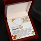 The "Daughter-Makes You Happy - Love Knot Necklace," a gold chain adorned with a heart pendant, is beautifully presented in an open wooden box. Inside the box, there's a heartfelt message addressed "To My Amazing Daughter," making it an ideal gift to symbolize your unbreakable bond.
