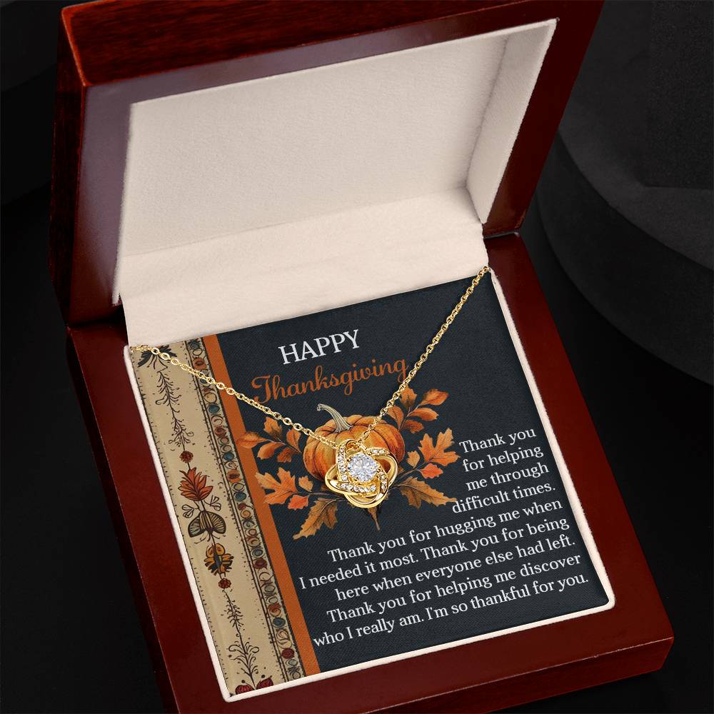 The Thanksgiving-I Really Am - Love Knot Necklace, elegantly presented in an open box, is paired with a Thanksgiving-themed card showcasing a message of gratitude and a pumpkin design. This exquisite necklace, embellished with dazzling cubic zirconia crystals, perfectly captures the warmth and togetherness of the season.