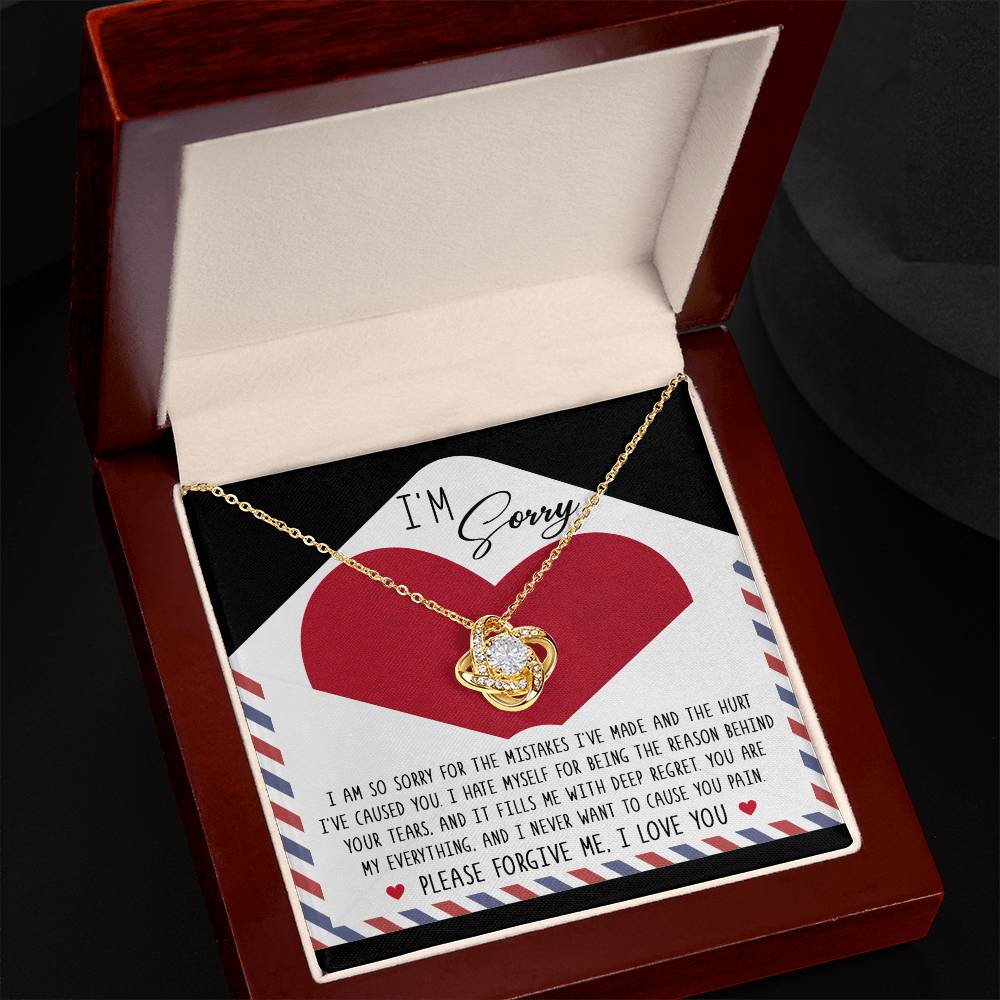 Sorry-Behind Your Tears - Love Knot Necklace with cubic zirconia crystals nestled in a velvet box, includes a heartfelt apology note expressing deep regret for causing pain and asking for forgiveness, ending with "I love you.