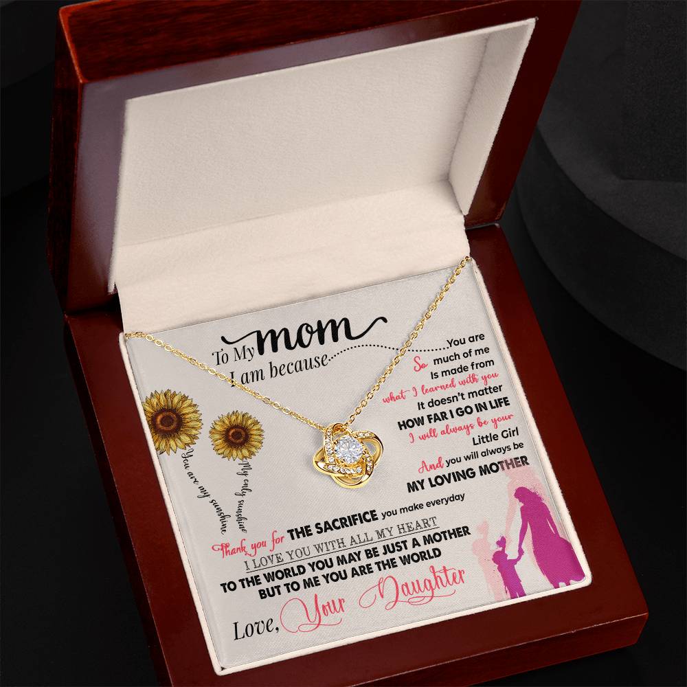 A "To My Mom, Thank You For Everything" Love Knot Necklace from ShineOn Fulfillment, with a heart-shaped pendant adorned with cubic zirconia and a gold finish, in a gift box with a heartfelt message for a mother from a daughter.