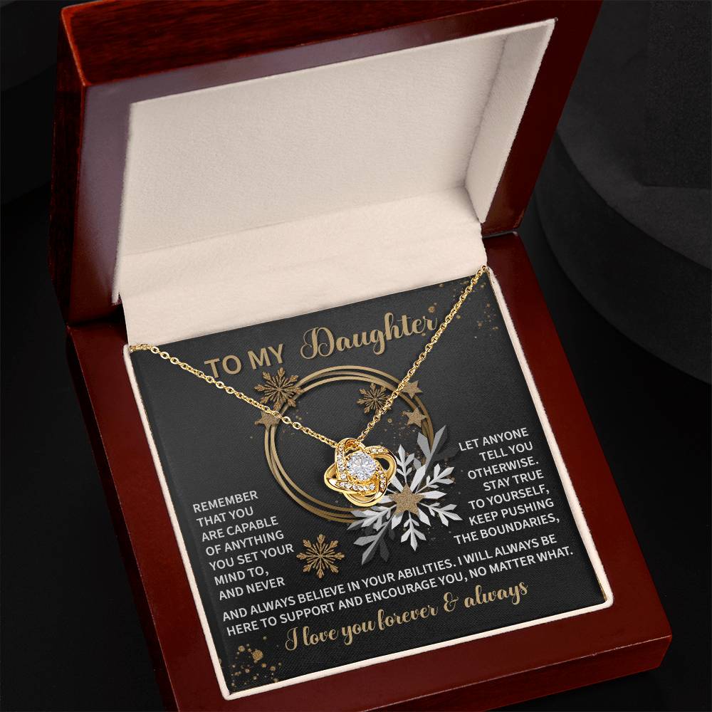 A personalized gift featuring the "Daughter-Set Your Mind" Love Knot Necklace with an interlocking heart pendant in a gift box. The lid inside displays an inspirational message surrounded by a floral design, making it a touching gesture of love and appreciation for your daughter.