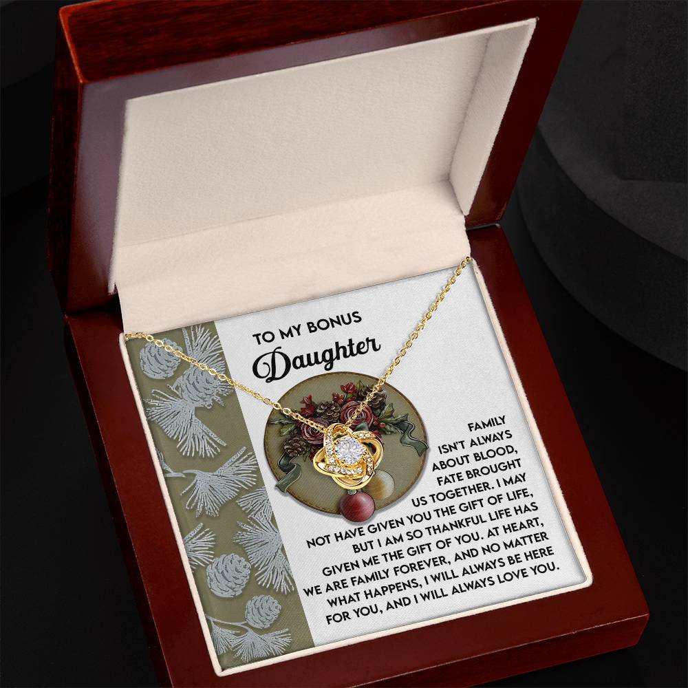 A customized gift, the Bonus Daughter-Gift Of You - Love Knot Necklace, is presented on a message card within a wooden box. Adorned with cubic zirconia, it includes the heartfelt message "To My Bonus Daughter" accompanied by a sentimental note.