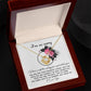 The Sorry-Make You Happy - Love Knot Necklace features a heart-shaped pendant adorned with cubic zirconia crystals, presented in a box decorated with pink flowers and the heartfelt text "I'm so sorry" at the top.