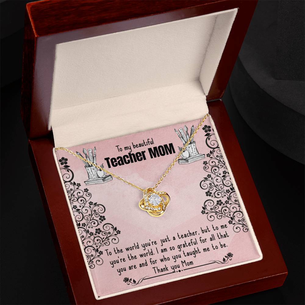An open jewelry box containing a To My Beautiful Teacher MOM Love Knot Necklace with cubic zirconia crystals, expressing gratitude and love for a mother who is also a teacher from ShineOn Fulfillment.