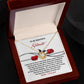 The Soulmate-Every Morning Love Knot Necklace, adorned with cubic zirconia crystals, is presented in an open wooden box. Inside is a romantic card addressed to a "Beautiful Soulmate," featuring roses and heartfelt text, ideal as a personalized gift for any occasion.
