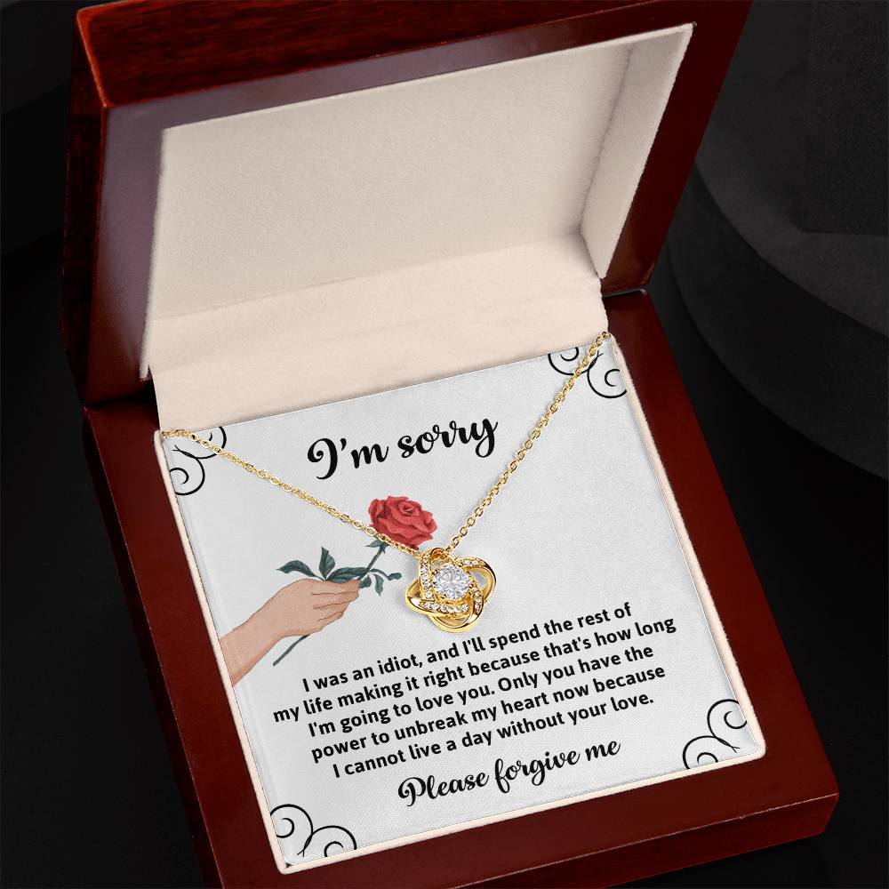 Presenting the "Sorry, Making It Right - Love Knot Necklace," a heartfelt expression of regret and love. This exquisite piece features an illustration of a hand holding a rose and comes with an apology message that conveys deep remorse and a devotion to making amends. Crafted from white gold, this necklace is adorned with sparkling cubic zirconia to add elegance and brilliance.