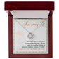 The "Sorry, Another Chance - Love Knot Necklace," featuring sparkling cubic zirconia crystals and crafted in 14k white gold, rests in a box. A note inside reads, "I'm sorry. Nothing is right in this world if I can't make this right. Please give me another chance to become a better version of myself. I love you and I am sorry, I truly am.