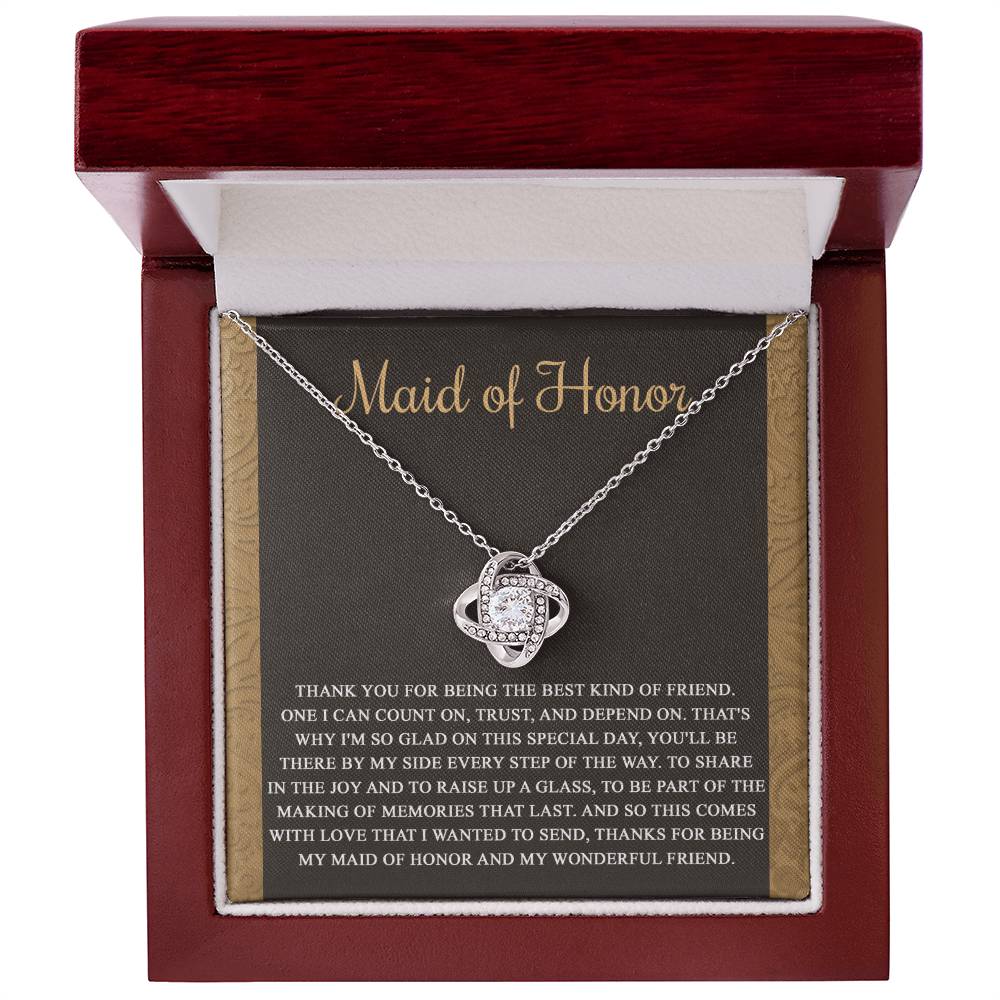 The "To Maid of Honor, Kind Of Friend - Love Knot Necklace" features an intertwined knot design adorned with cubic zirconia crystals on a background that reads "Maid of Honor," followed by a heartfelt thank you message to the maid of honor.