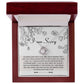 Introducing the "Sorry-Your Big Heart - Love Knot Necklace": This exquisite white gold necklace showcases an elegant intertwined heart design, adorned with shimmering cubic zirconia crystals. It comes complete with a heartfelt card that reads, "I am Sorry," followed by an apologetic message. The entire set is beautifully presented in a floral-printed box.