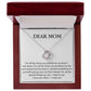 A Dear Mom, For All The Times You Picked Me Up Love Knot Necklace with a pendant inside a gift box that has a sentimental message addressed to "mom" printed on the inside cover from ShineOn Fulfillment.