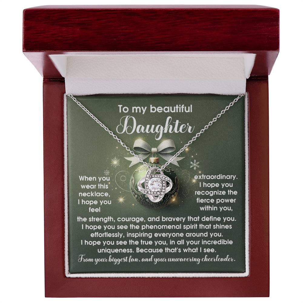 The "Daughter-Incredible Uniqueness - Love Knot Necklace" is elegantly presented in a wooden box with a message card for "Daughter," beautifully conveying love, pride, and encouragement. This personalized gift is adorned with premium cubic zirconia, offering an elegant touch to this heartfelt keepsake.