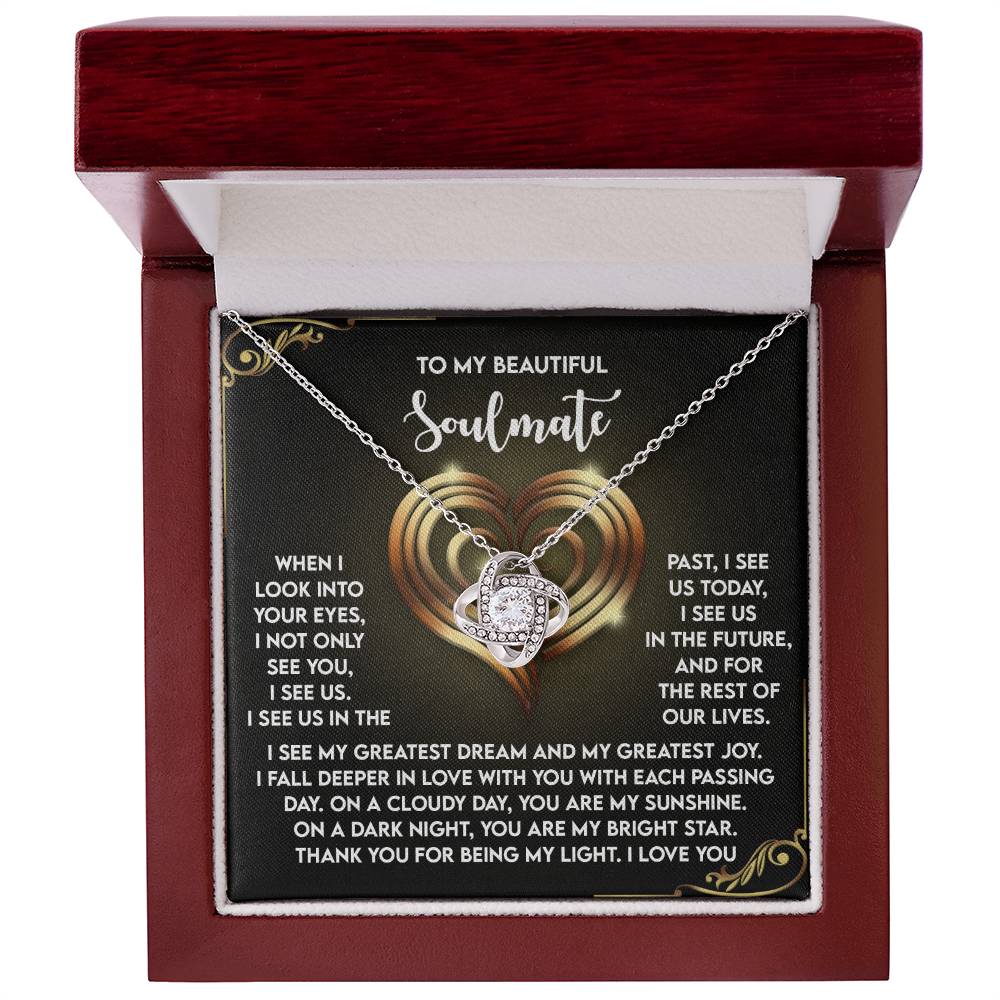 The Soulmate-I See Us - Love Knot Necklace, set in a wooden box with a "To My Beautiful Soulmate" message card, features cubic zirconia crystals on its heart-shaped pendant. It's an ideal personalized gift for your cherished one.