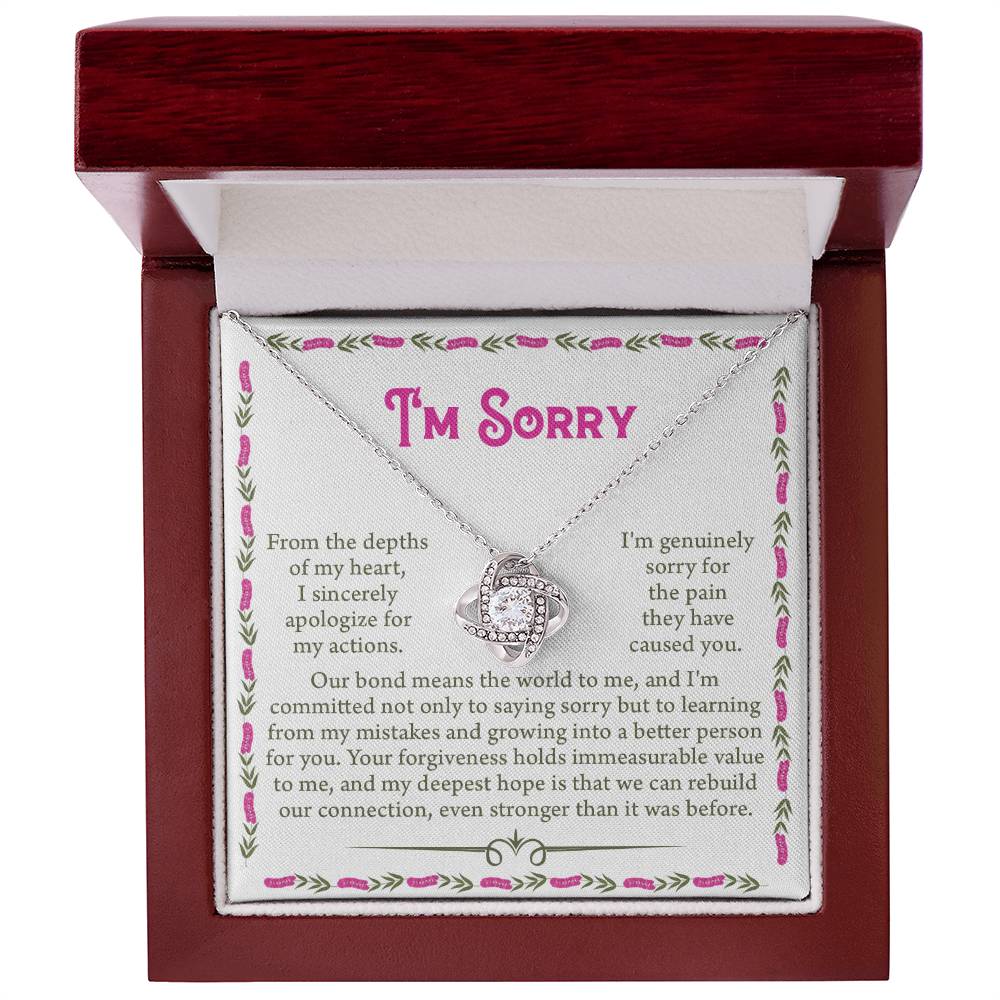 The Sorry-A Better Person - Love Knot Necklace, adorned with shimmering cubic zirconia crystals, comes elegantly presented in a red jewelry box. Accompanied by an apology note that expresses heartfelt regret for past actions and a sincere promise to rebuild a stronger bond, the note features a decorative border that perfectly complements the necklace's elegance.