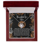 Introducing the "Thanksgiving-To Call You - Love Knot Necklace," presented in a box with a heartfelt message about family. This beautiful piece features sparkling cubic zirconia accents and a stunning white gold finish.