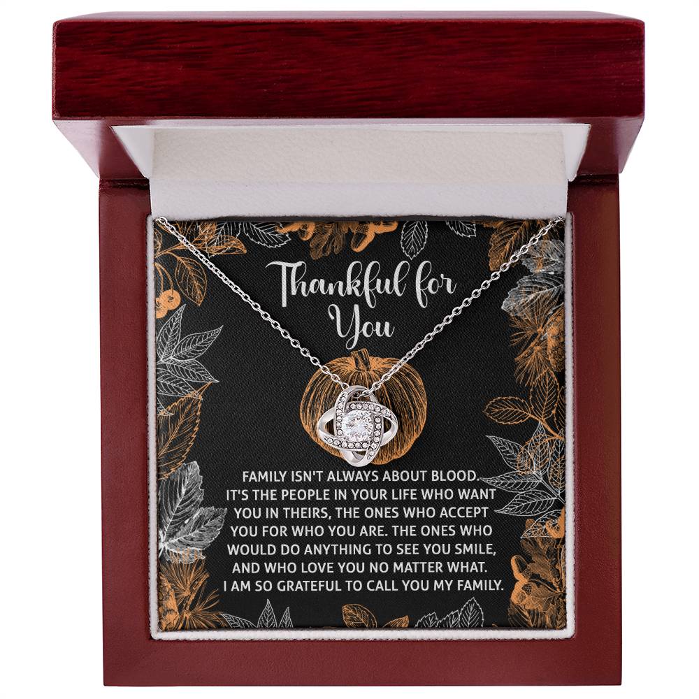 Introducing the "Thanksgiving-To Call You - Love Knot Necklace," presented in a box with a heartfelt message about family. This beautiful piece features sparkling cubic zirconia accents and a stunning white gold finish.