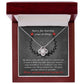 A Sorry-Make Amends - Love Knot Necklace in an open red box with a heartfelt apology message on the inner lid, adorned with sparkling cubic zirconia crystals, expressing remorse and a promise to make amends.