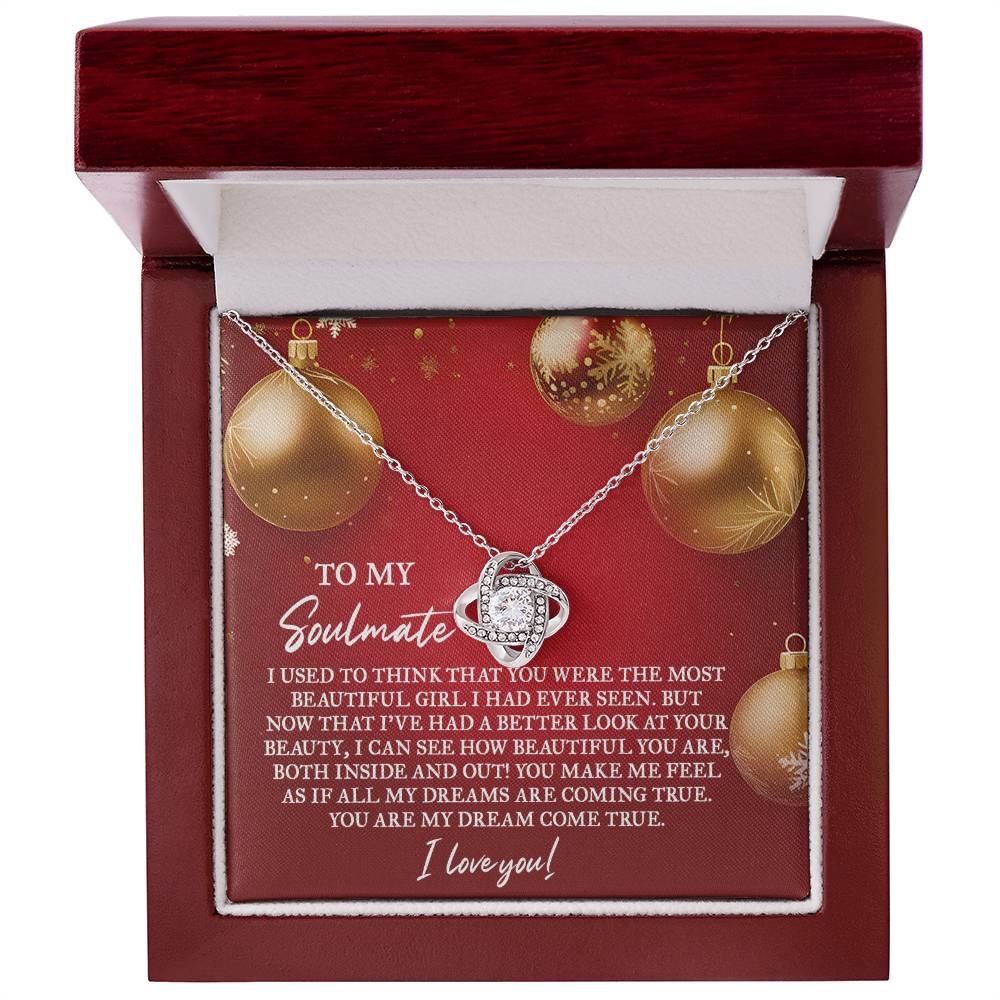 The Soulmate-Your Beauty - Love Knot Necklace, embellished with sparkling cubic zirconia crystals, is elegantly presented in a red jewelry box. The inside of the lid features a heartfelt soulmate message, making this personalized gift truly special, enhanced by its captivating space-themed pendant design.