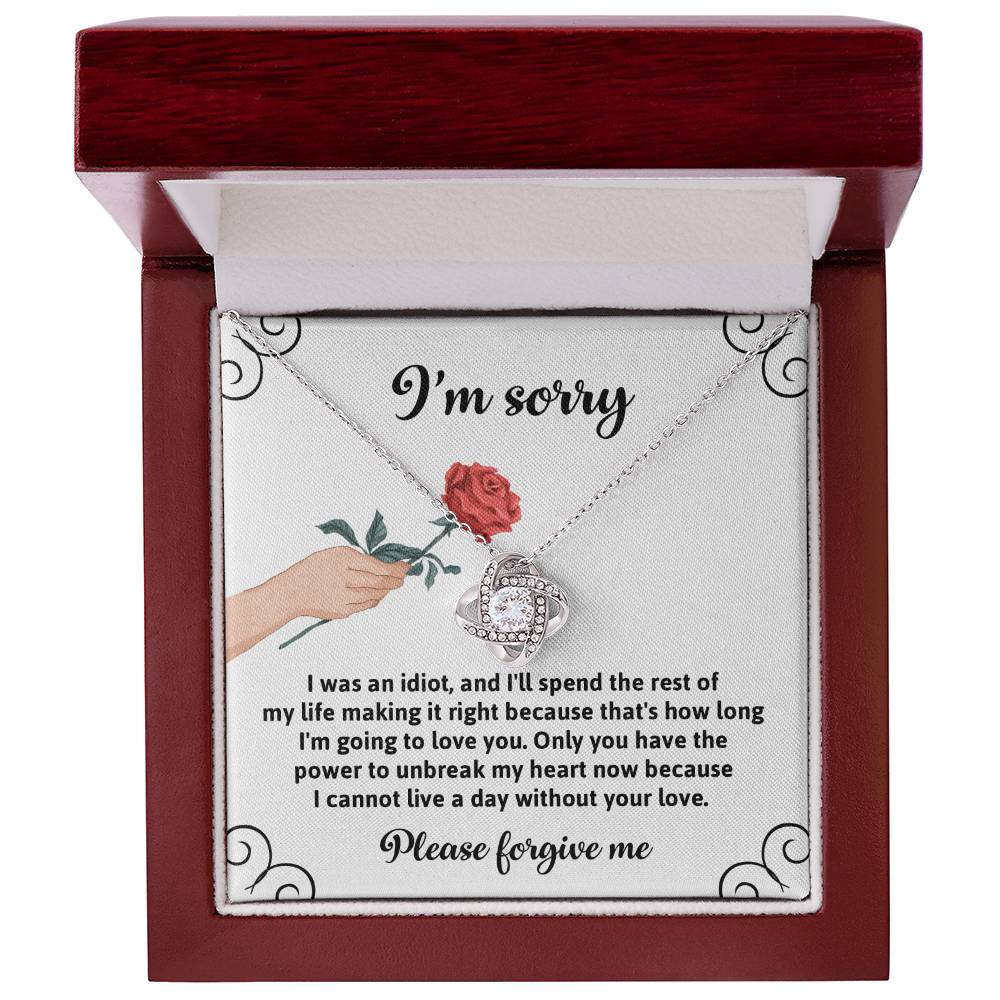 Presenting the "Sorry, Making It Right - Love Knot Necklace," a heartfelt expression of regret and love. This exquisite piece features an illustration of a hand holding a rose and comes with an apology message that conveys deep remorse and a devotion to making amends. Crafted from white gold, this necklace is adorned with sparkling cubic zirconia to add elegance and brilliance.