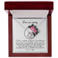 The Sorry-Make You Happy - Love Knot Necklace features a heart-shaped pendant adorned with cubic zirconia crystals, presented in a box decorated with pink flowers and the heartfelt text "I'm so sorry" at the top.