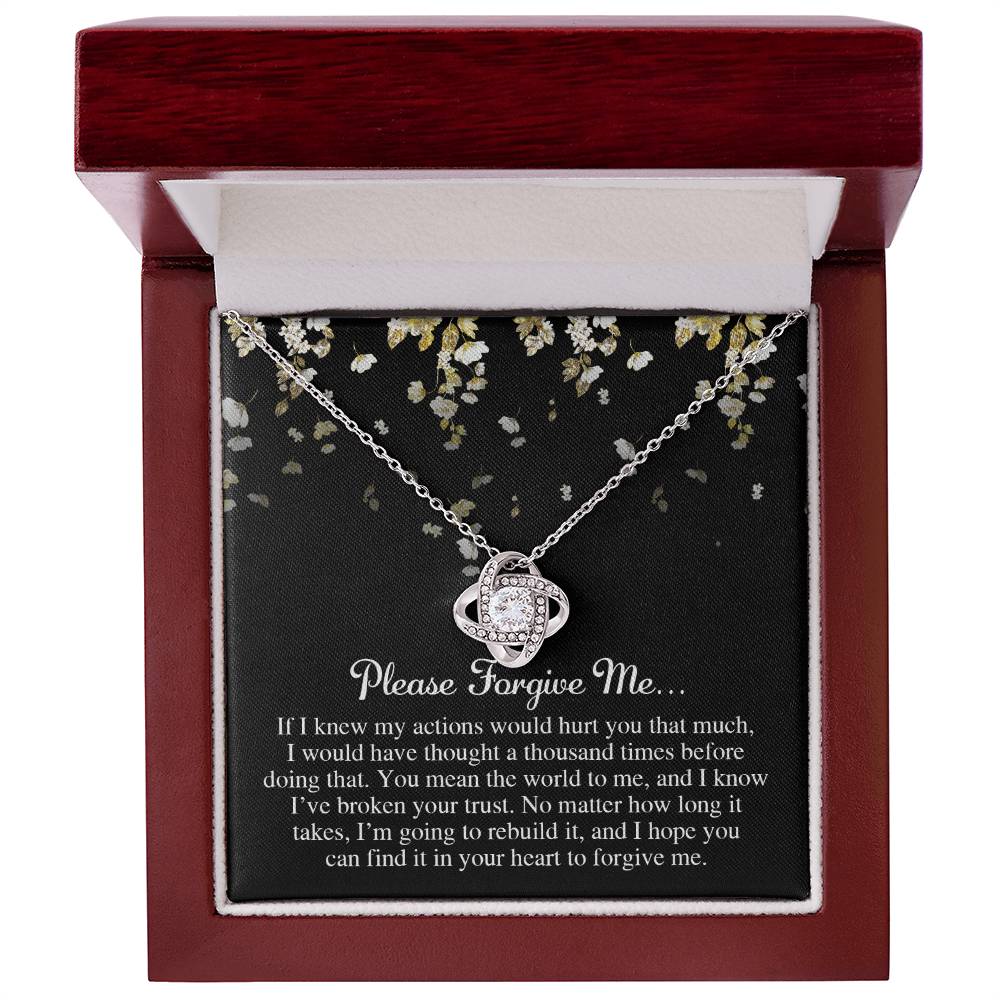 The "Sorry-Broken Your Trust - Love Knot Necklace" in a wooden box adorned with cubic zirconia crystals, accompanied by a heartfelt note that says, "Please forgive me. I'm going to rebuild trust," and an elaborate message about love and remorse, makes for the perfect personalized gift.