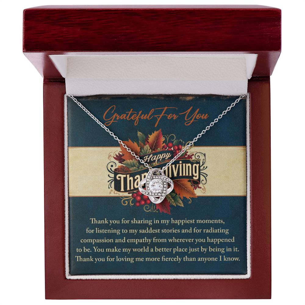 The Thanksgiving-Happiest Moments - Love Knot Necklace, presented in a wooden box with a Thanksgiving card, beautifully conveys gratitude for companionship. Enhanced by autumn leaves and decorative text, this personalized gift serves as an elegant token of appreciation and cherished memories.