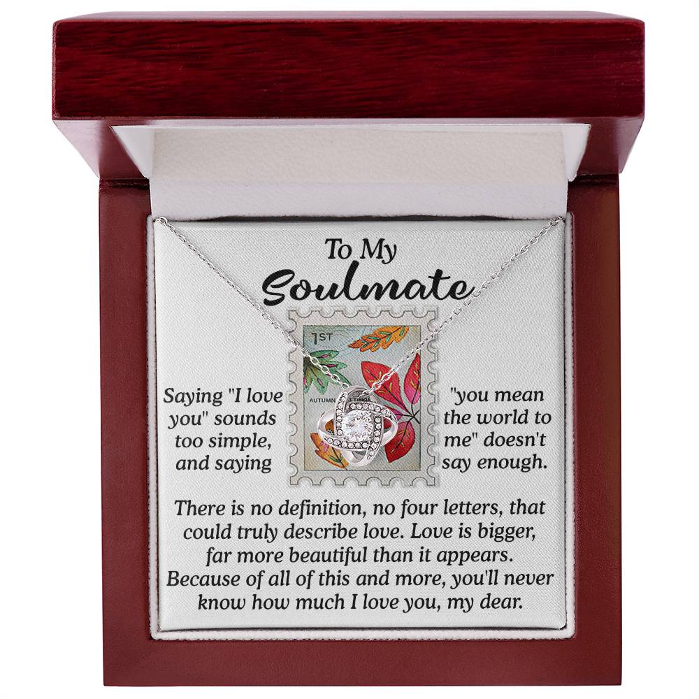 Open jewelry box displaying the Soulmate-Far More Beautiful - Love Knot Necklace adorned with cubic zirconia crystals, resting beside a heartfelt message titled "To My Soulmate.